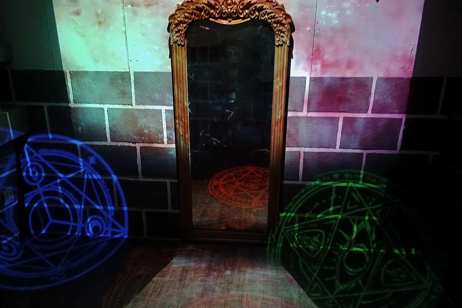 Colourful magical symbols projected around the Academy of Magic room
