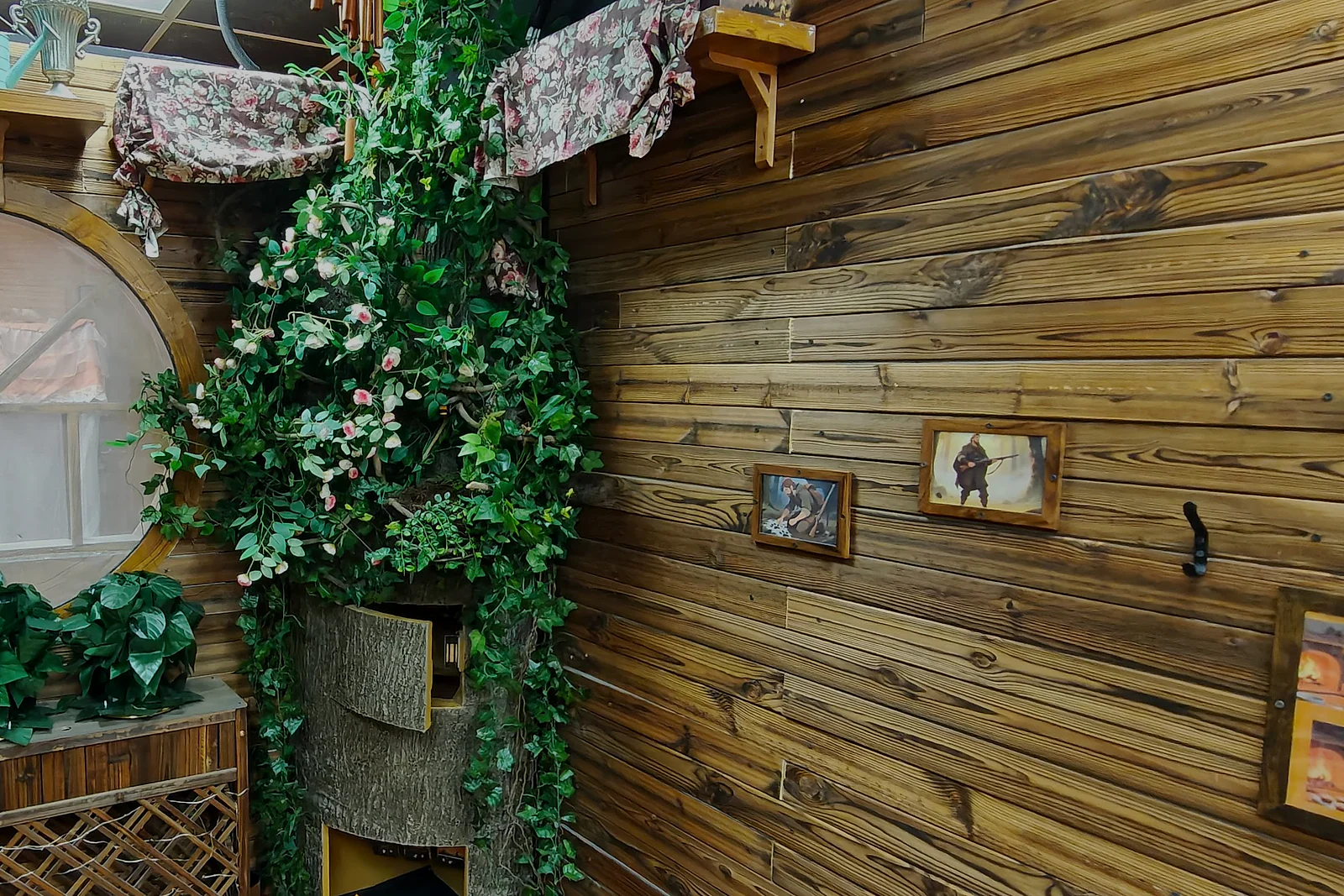 Storybook cottage and flowering tree details inside Red Riding Hood