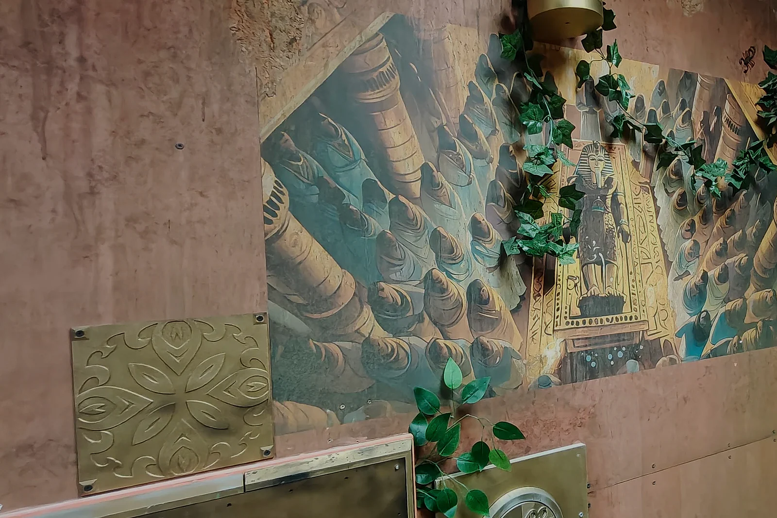 Egyptian-inspired mural and set details inside The Alchemist